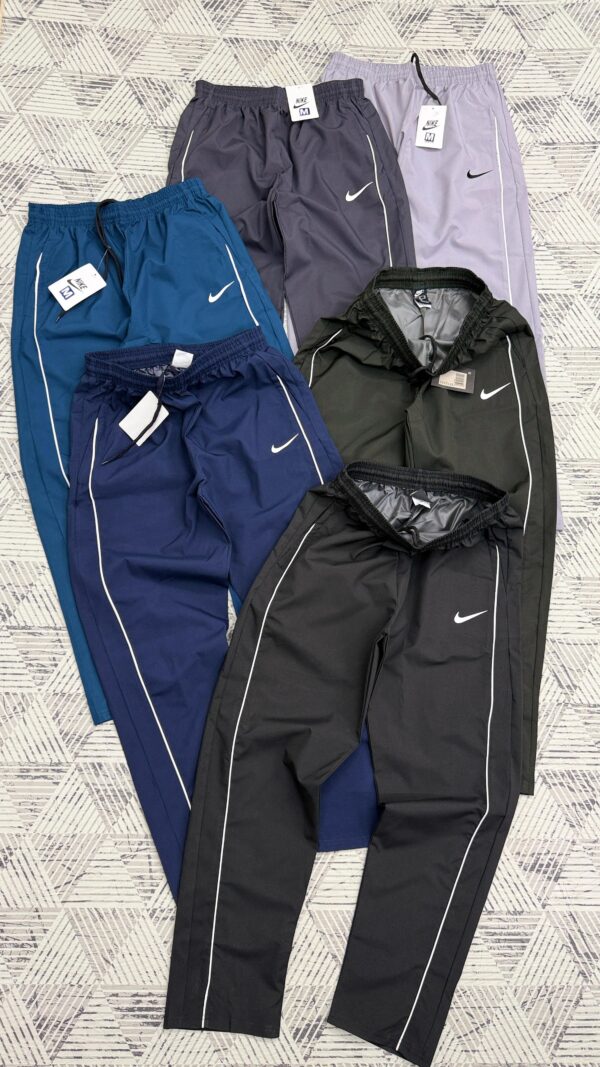 NIKE PIPED NET FOLDING TRACKPANT
