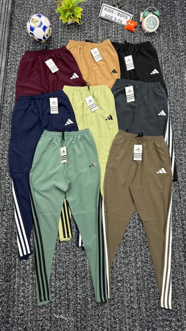 ADIDAS THREE STRIPES NS LYCRA WITH STRIPES NET FOLDING KIDS TRACKPANT